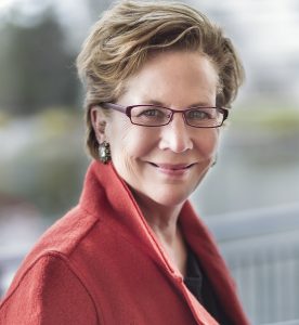 Jane O. Smit Headshot in a Red Jacket